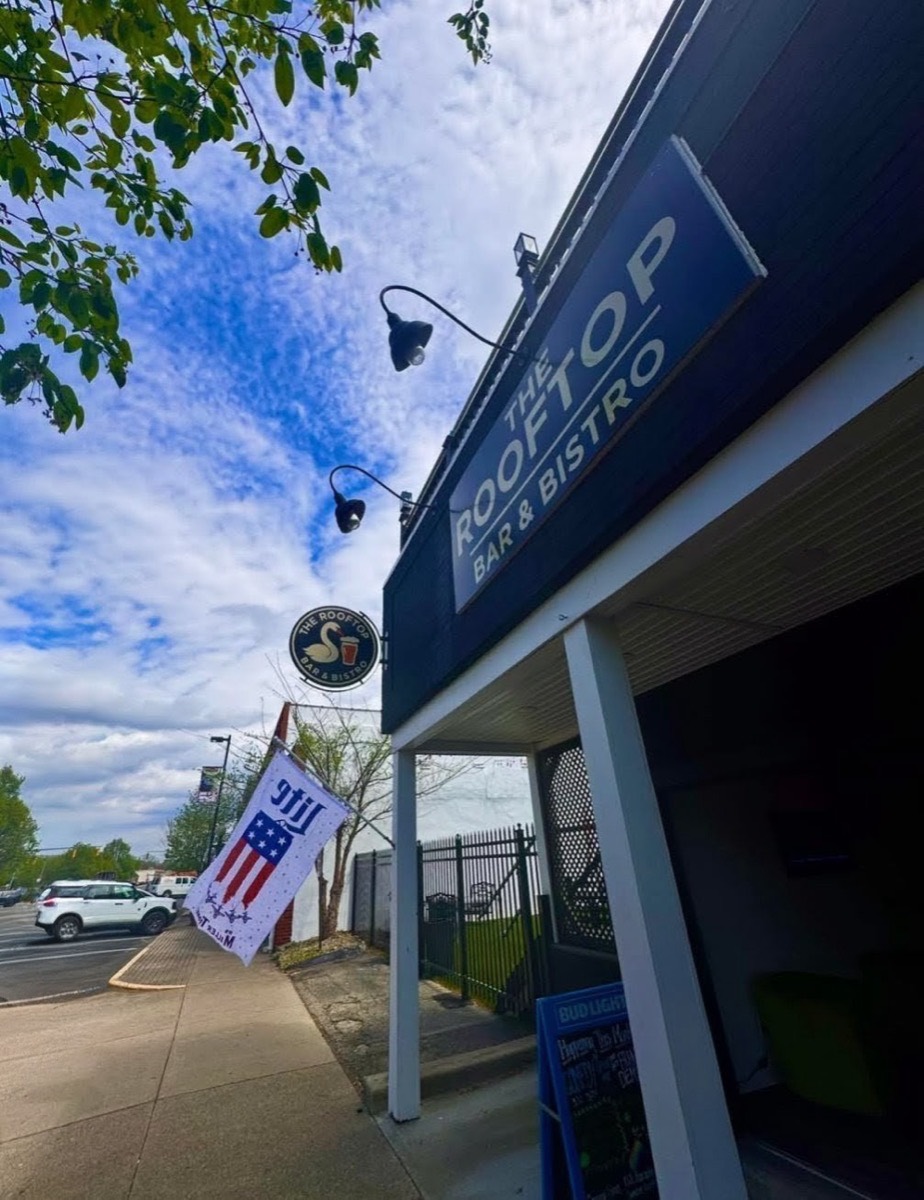 The Rooftop Bar and Bistro sign and awning on West Water Street on a clear day